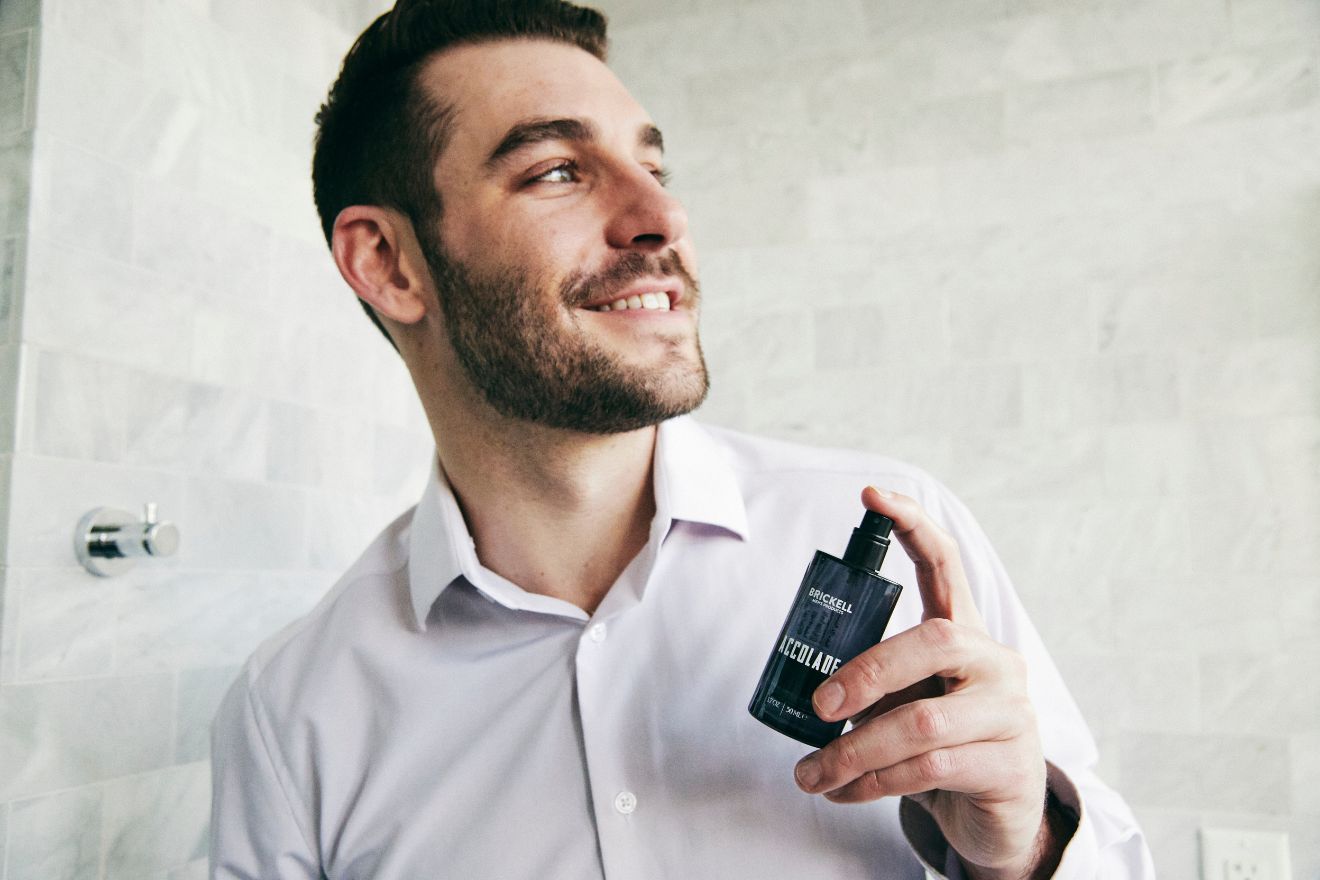 Man applying cologne