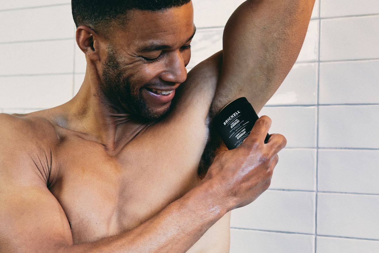 Man applying natural deodorant