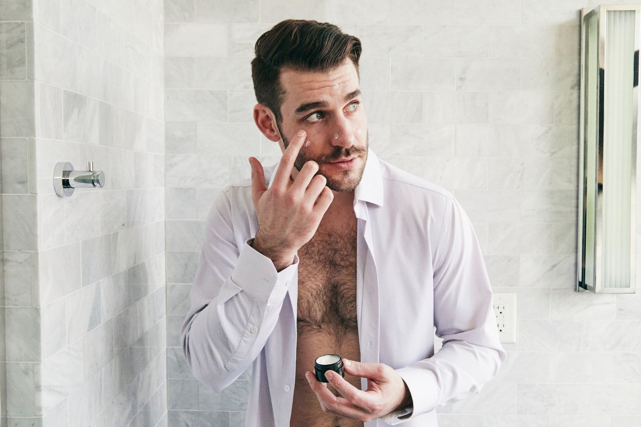 Man applying skincar product