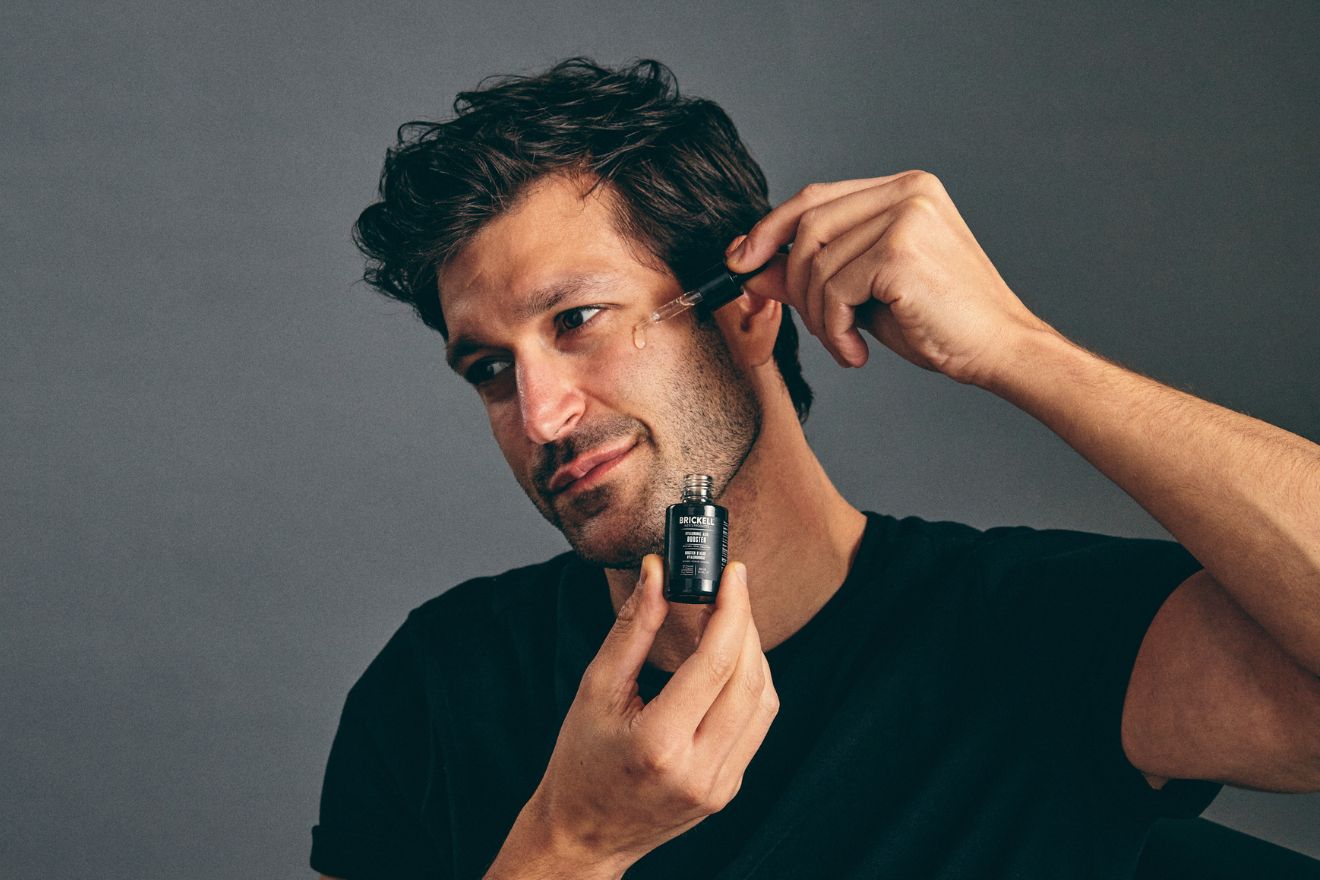 Man applying skincare product