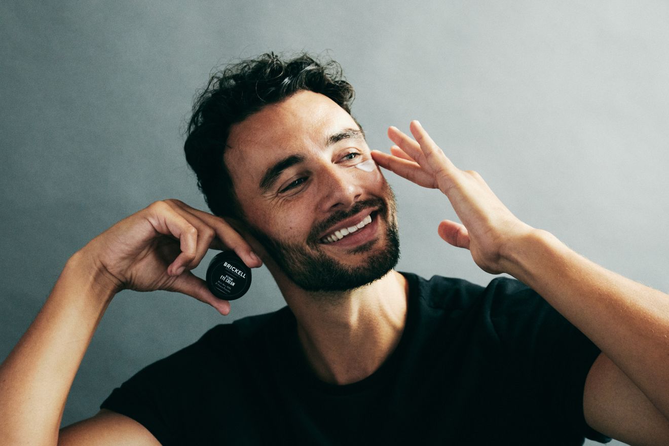 Man applying eye cream