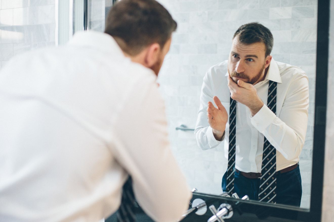 Man looking in mirror