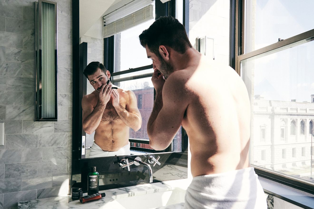 Man shaving his face