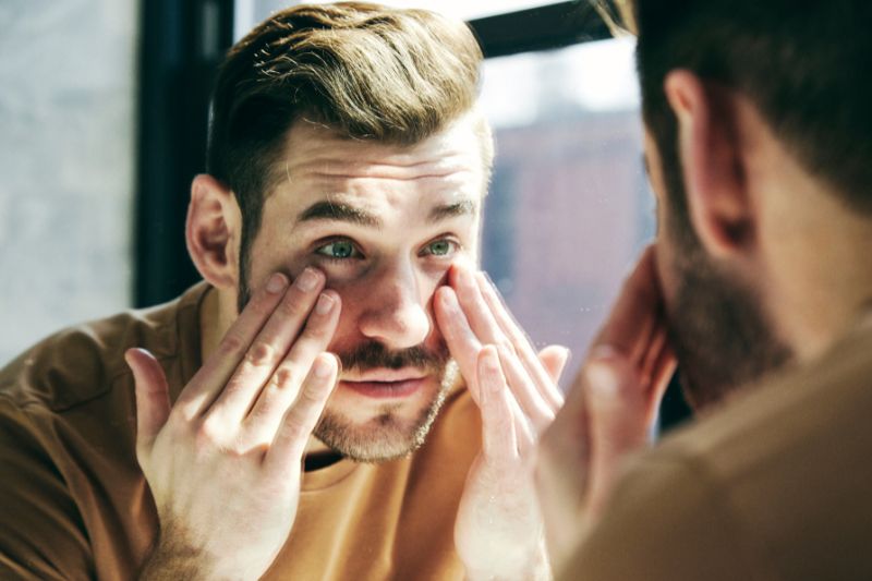 Man looking in mirror