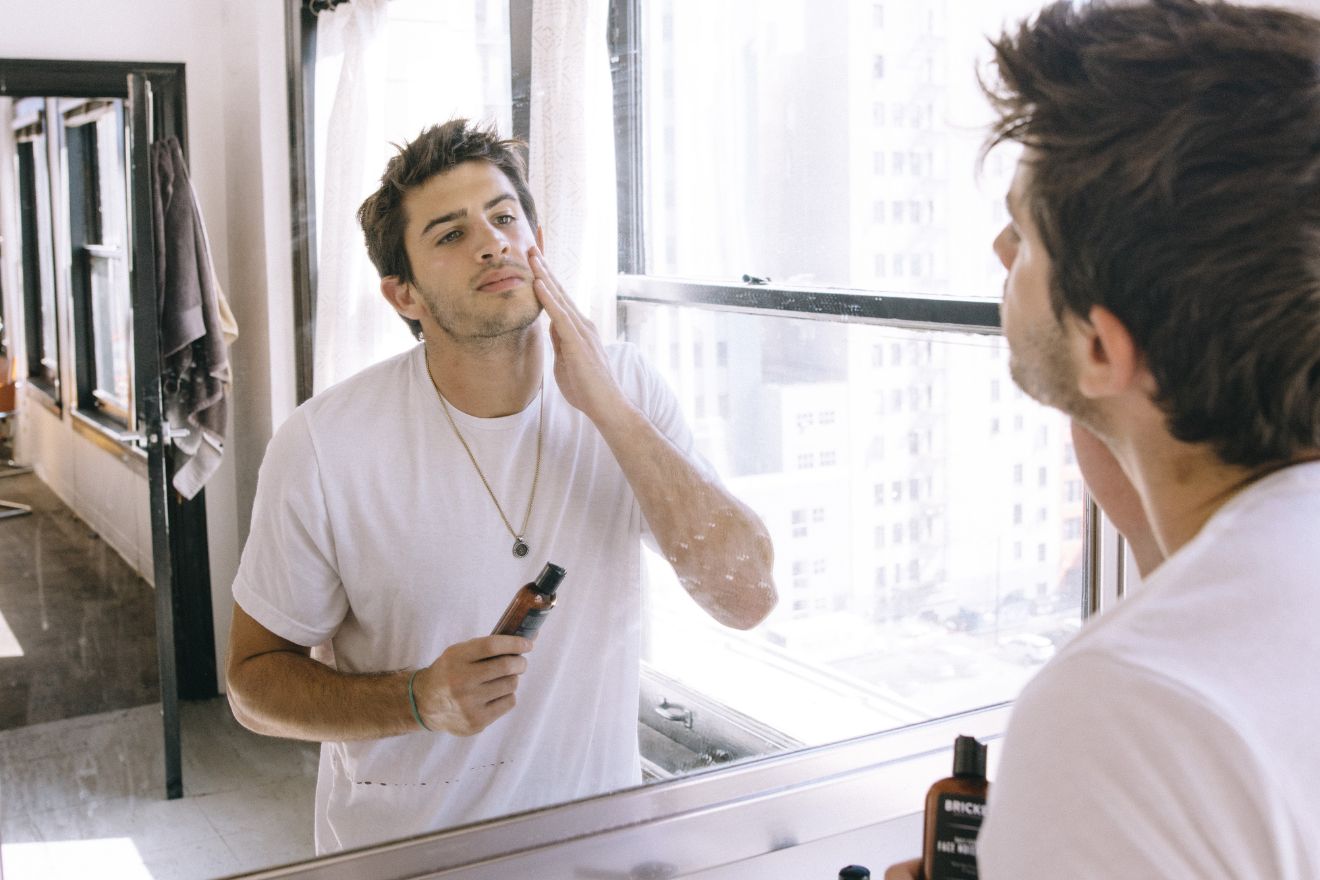 Man applying face cream